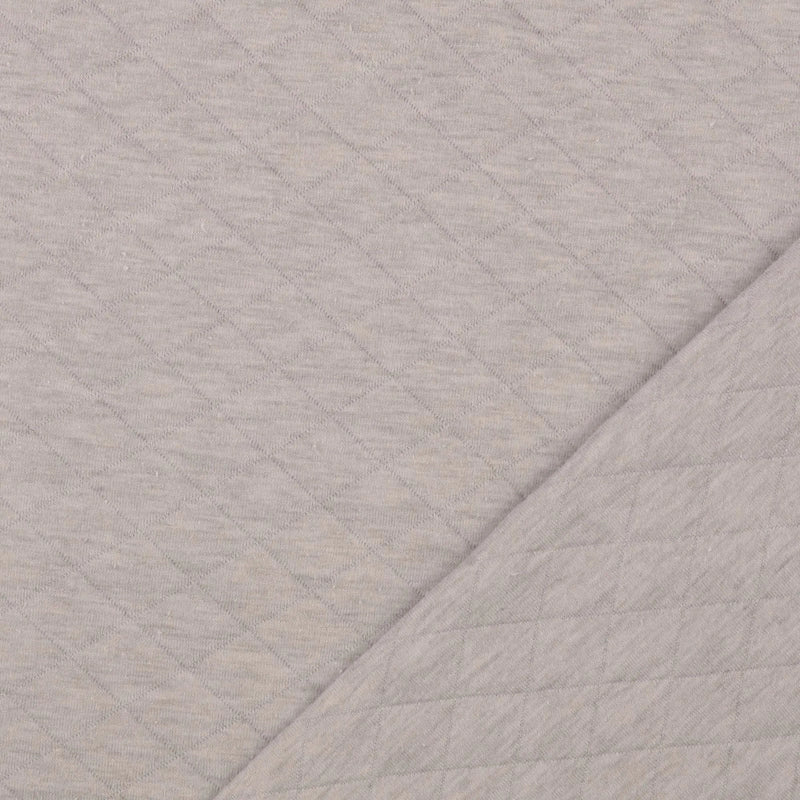 Jersey Stepper Stoff in Beige mit gesteppter Struktur für Jacken, Babykleidung und moderne Nähprojekte