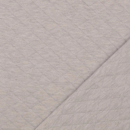 Jersey Stepper Stoff in Beige mit gesteppter Struktur für Jacken, Babykleidung und moderne Nähprojekte