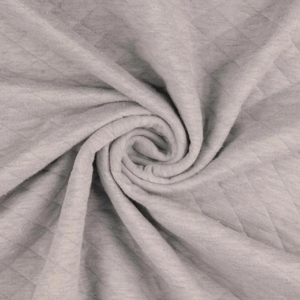 Jersey Stepper Stoff in Beige mit gesteppter Struktur für Jacken, Babykleidung und moderne Nähprojekte