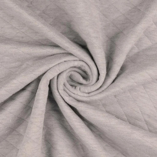 Jersey Stepper Stoff in Beige mit gesteppter Struktur für Jacken, Babykleidung und moderne Nähprojekte